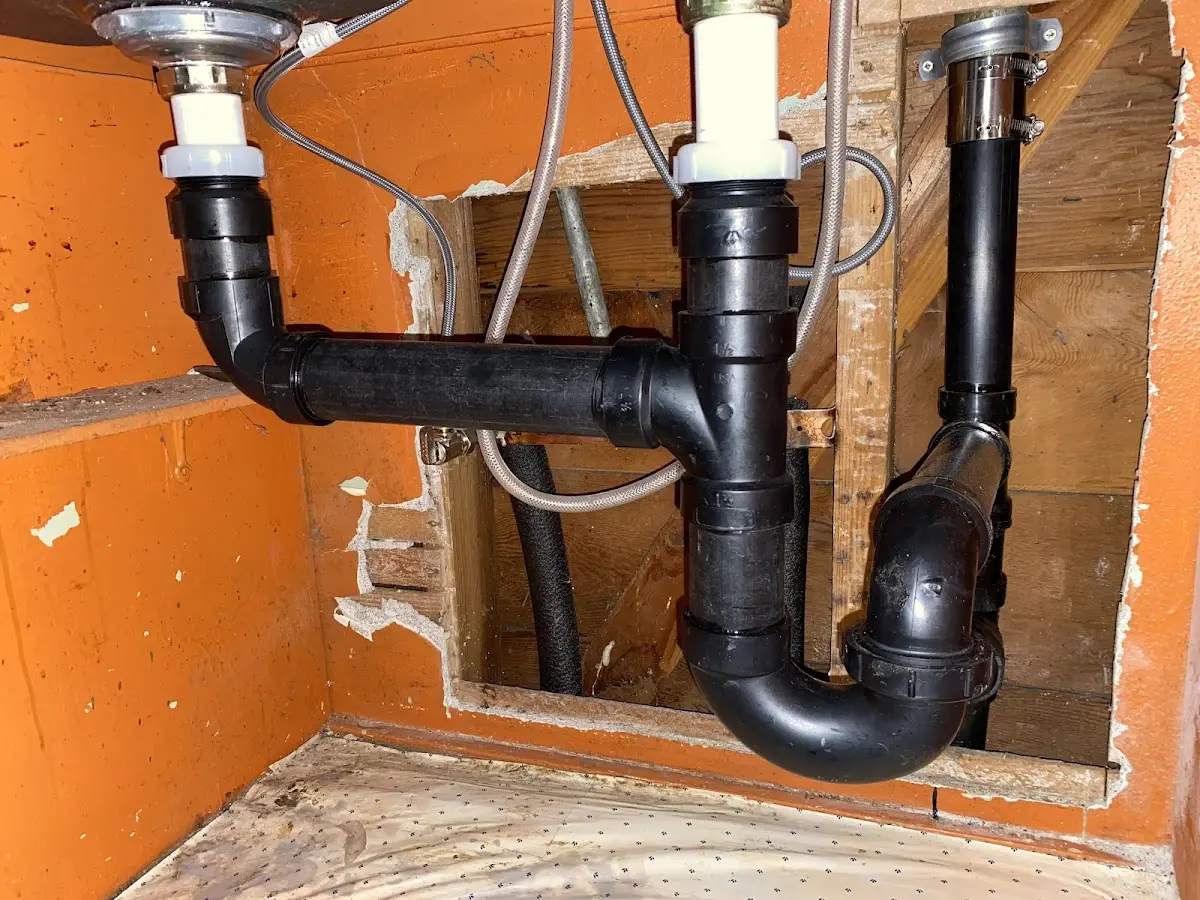 Professional Garbage Disposal Repair equipment and tools on the job in Somerville